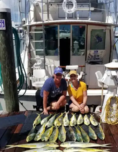 Two ladies and all the fish they caught.